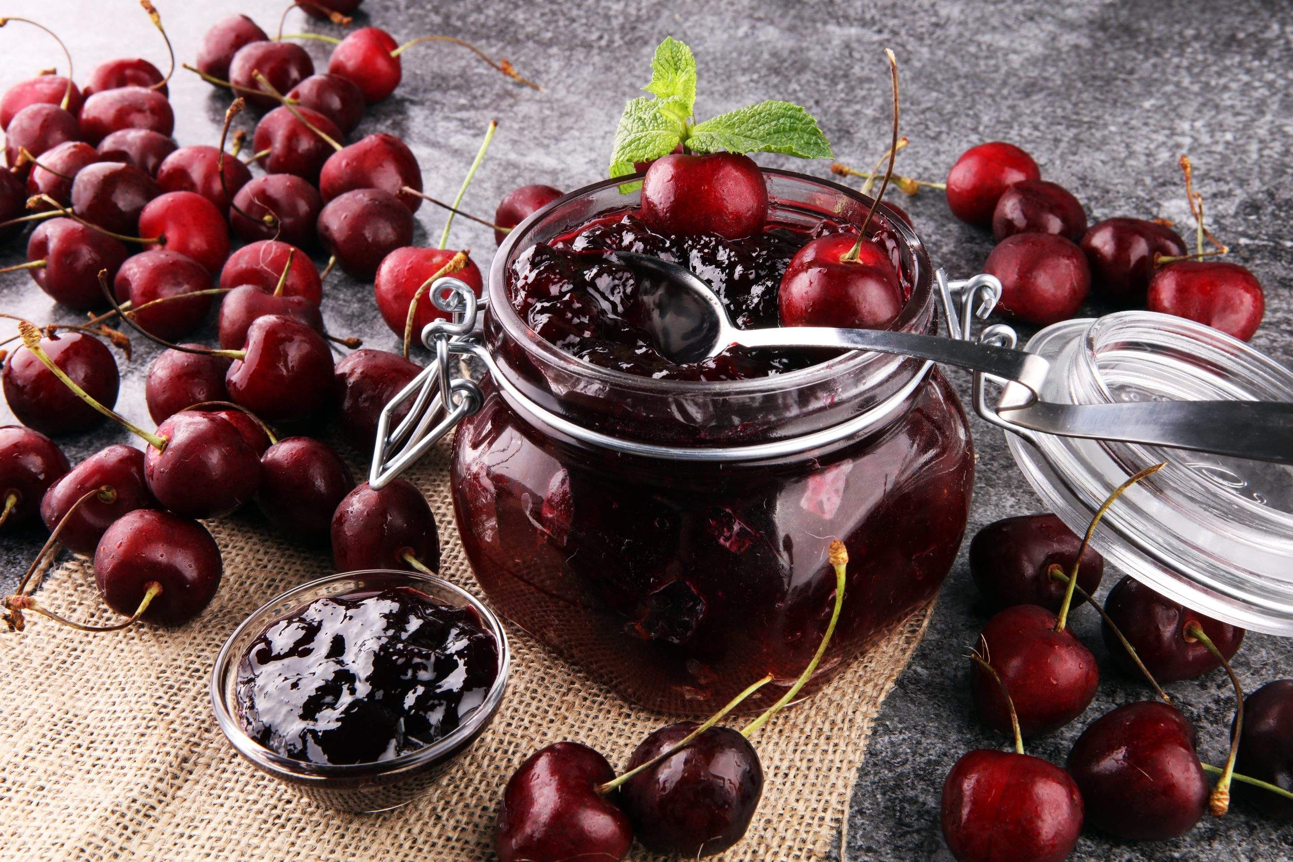 Jar,Of,Cherry,Jam,,Sour,Cherries,And,Spoon