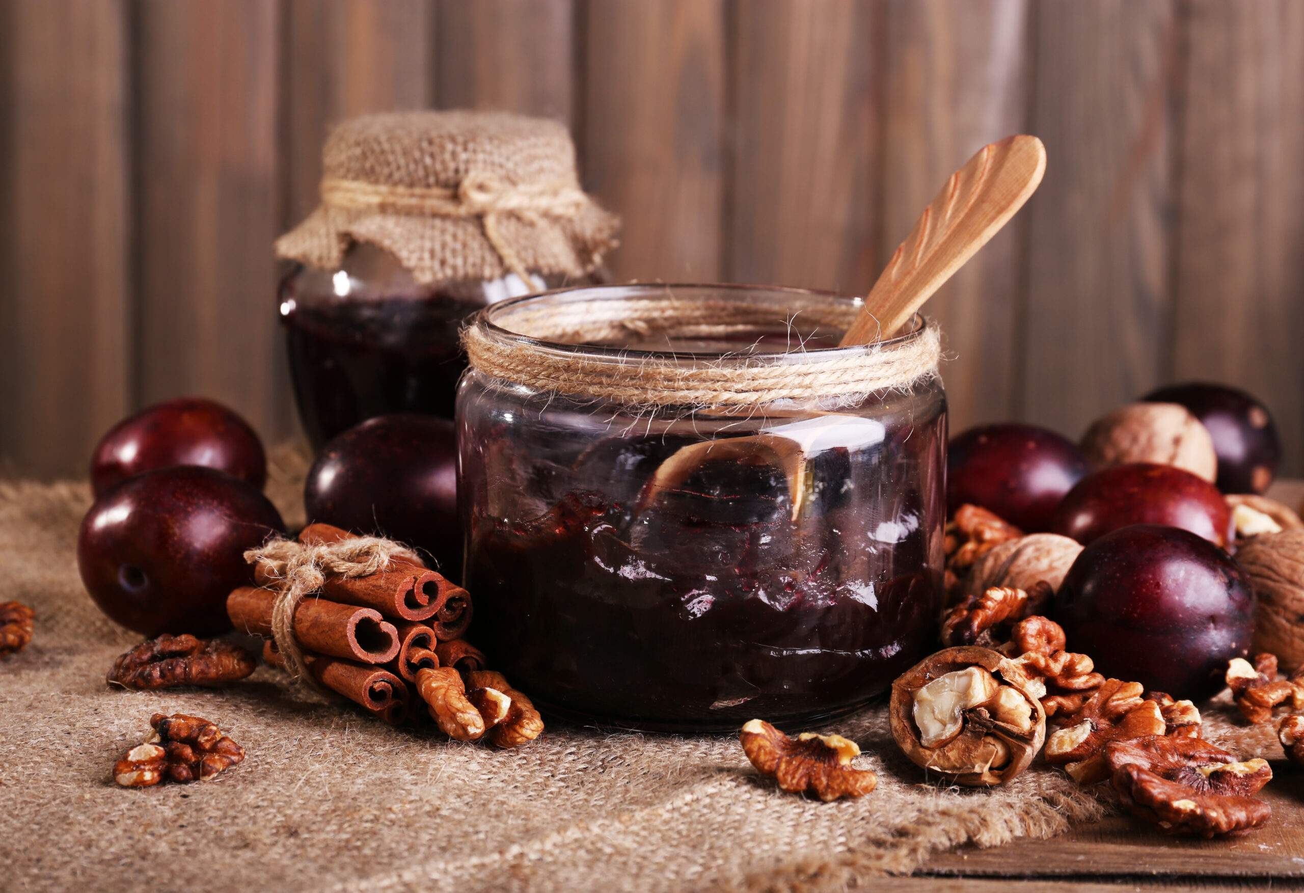 Tasty,Plum,Jam,In,Jars,And,Plums,On,Wooden,Table