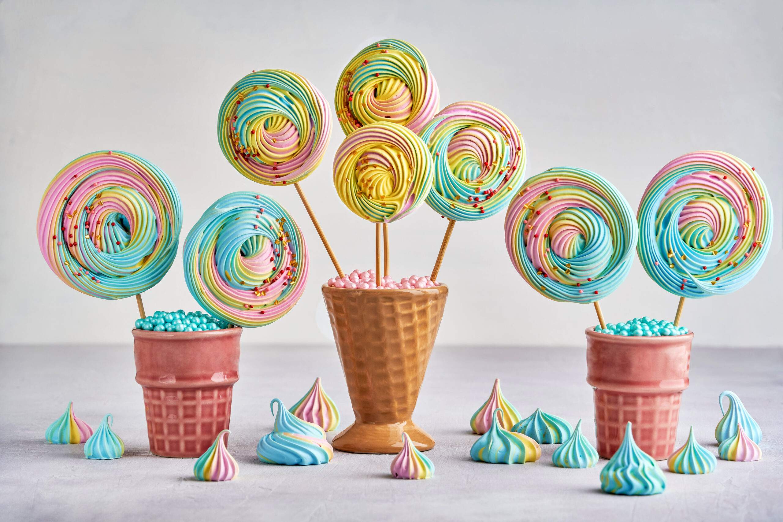 Colorful,Meringue,Lollipop,In,Ceramic,Cone.,Closeup,With,Copy,Space