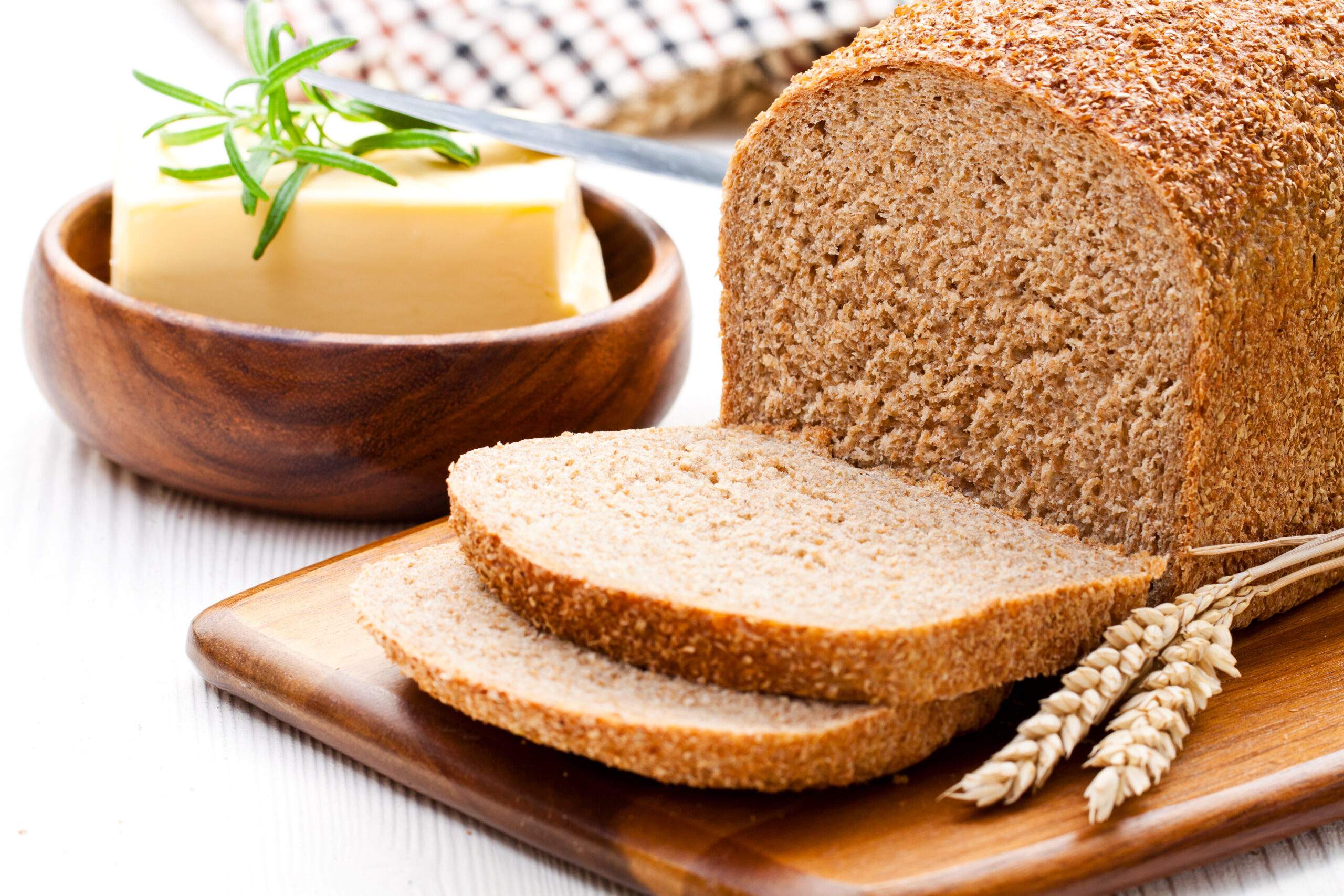 Sliced,Slow-baked,Organic,Wholemeal,Bread,With,Butter,And,Rosemary,And